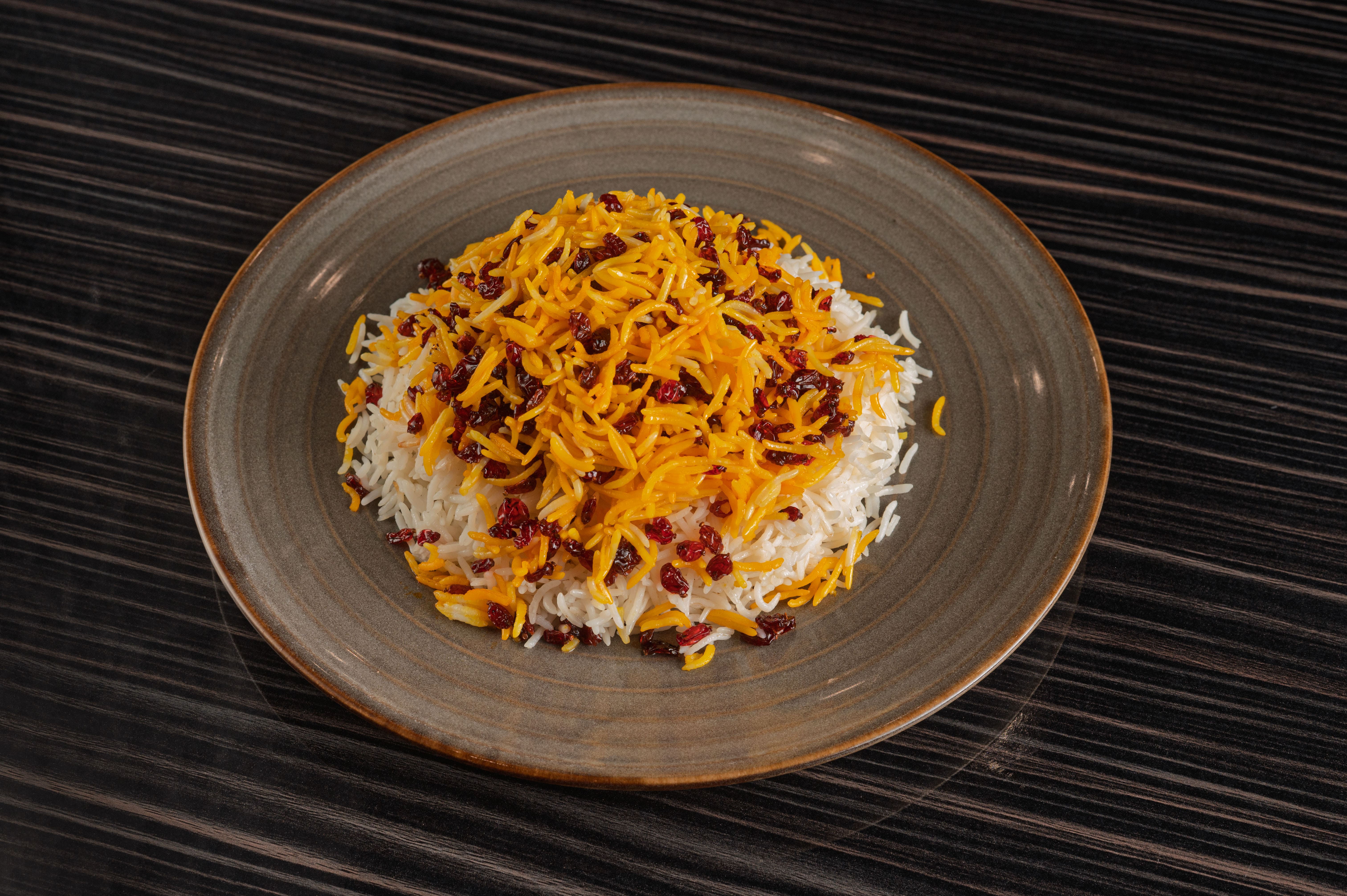 Zereshk Polo with saffron rice and barberries served at Aban Restaurant in Houston
