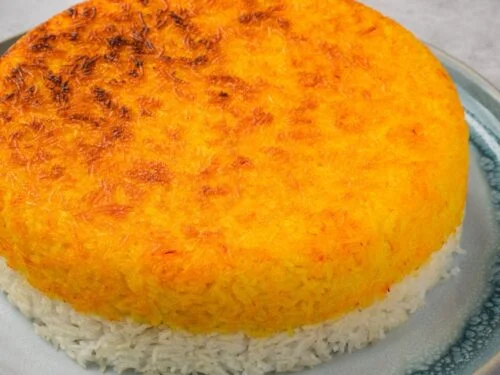 Perfectly flipped Persian Tahdig showcasing golden crispy rice texture